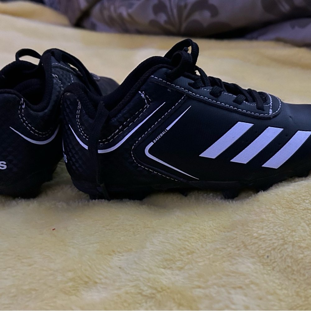 Black Soccer Cleats with White Accents